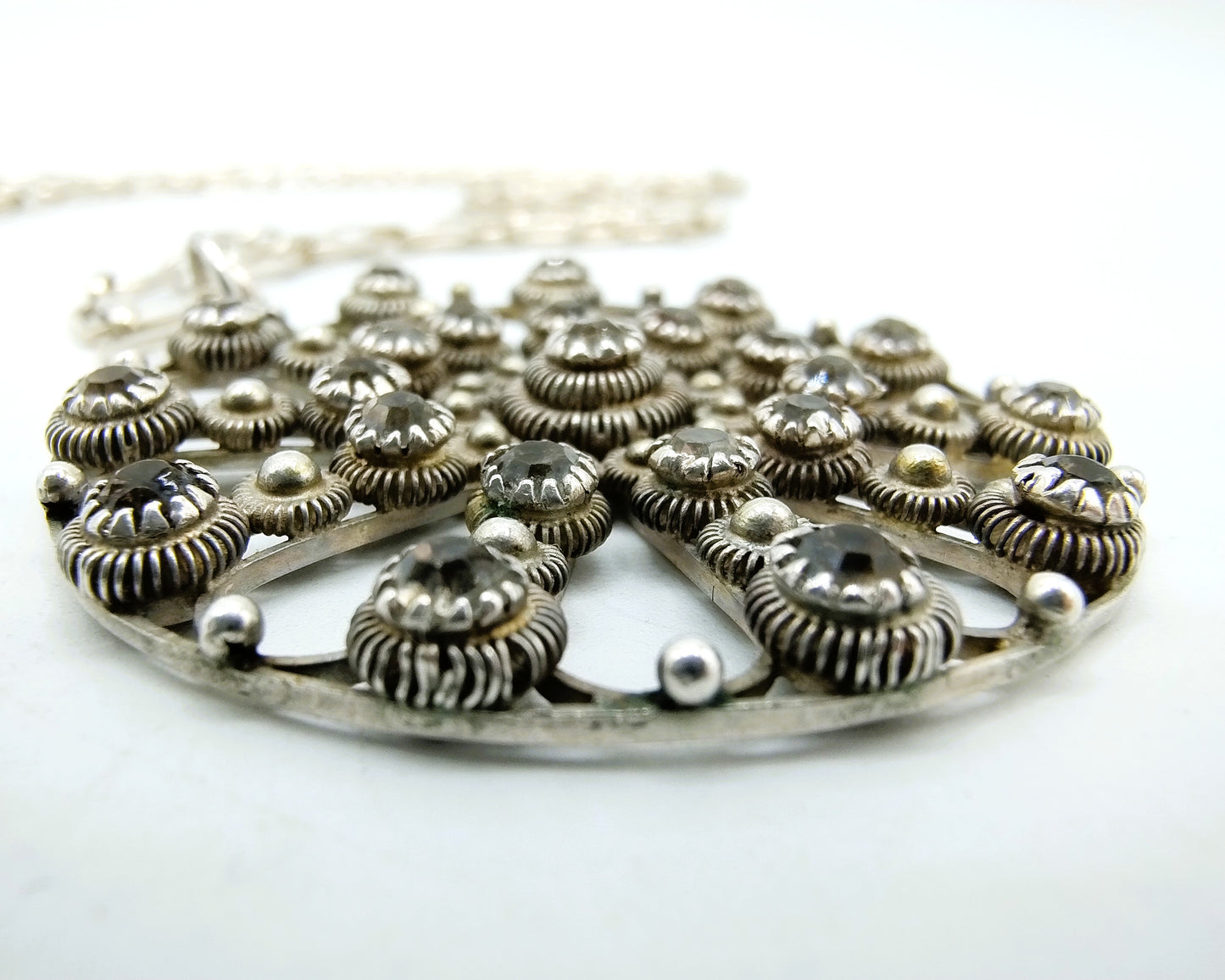 Zeeland silver button pendant inlaid with stones, on a chain