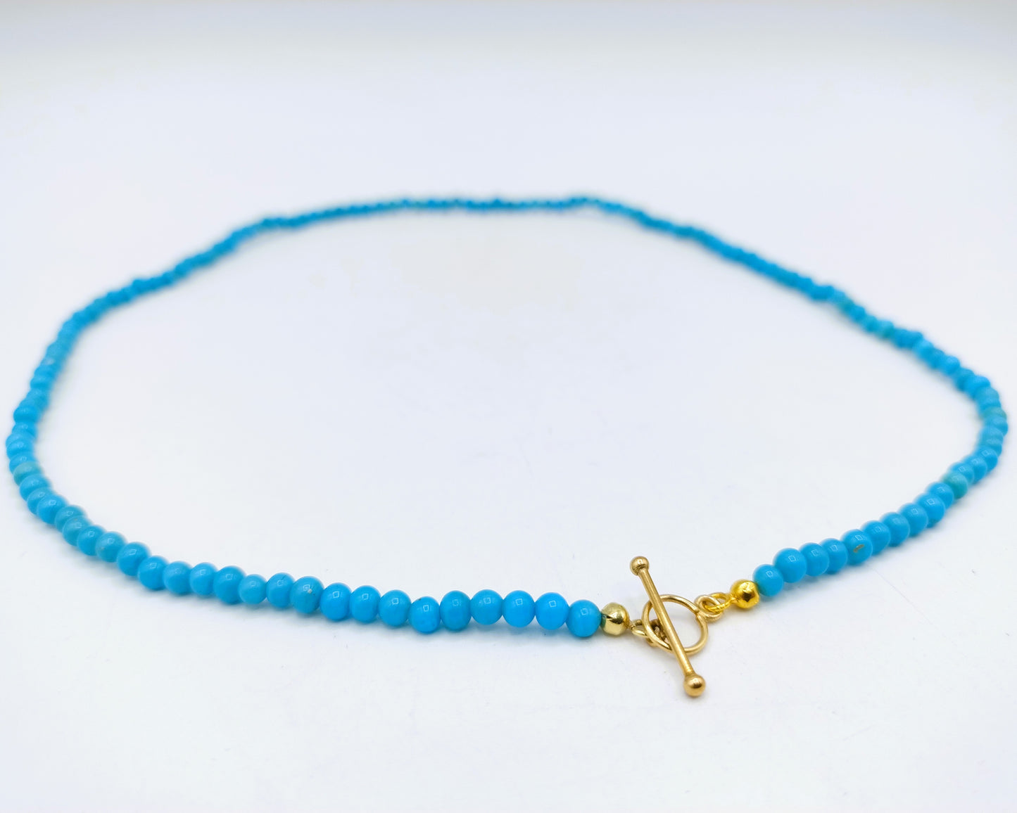 Turquoise necklace with gold toggle clasp, 585