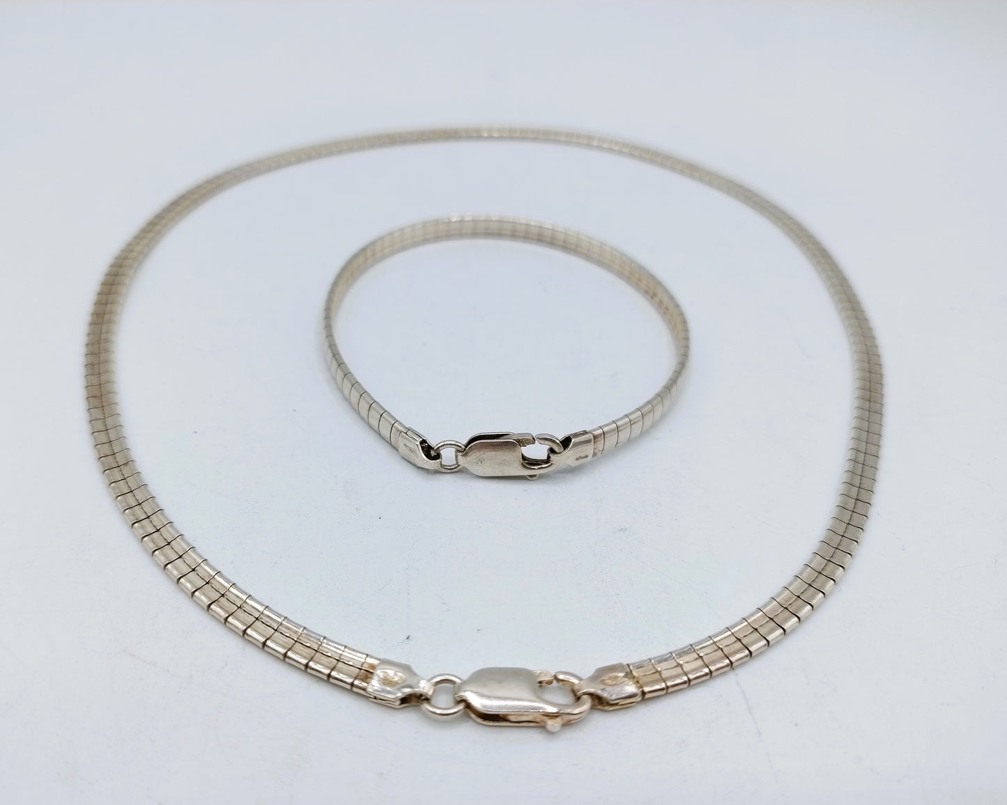 Silver omega necklace (42 cm) + bracelet, (19 cm).