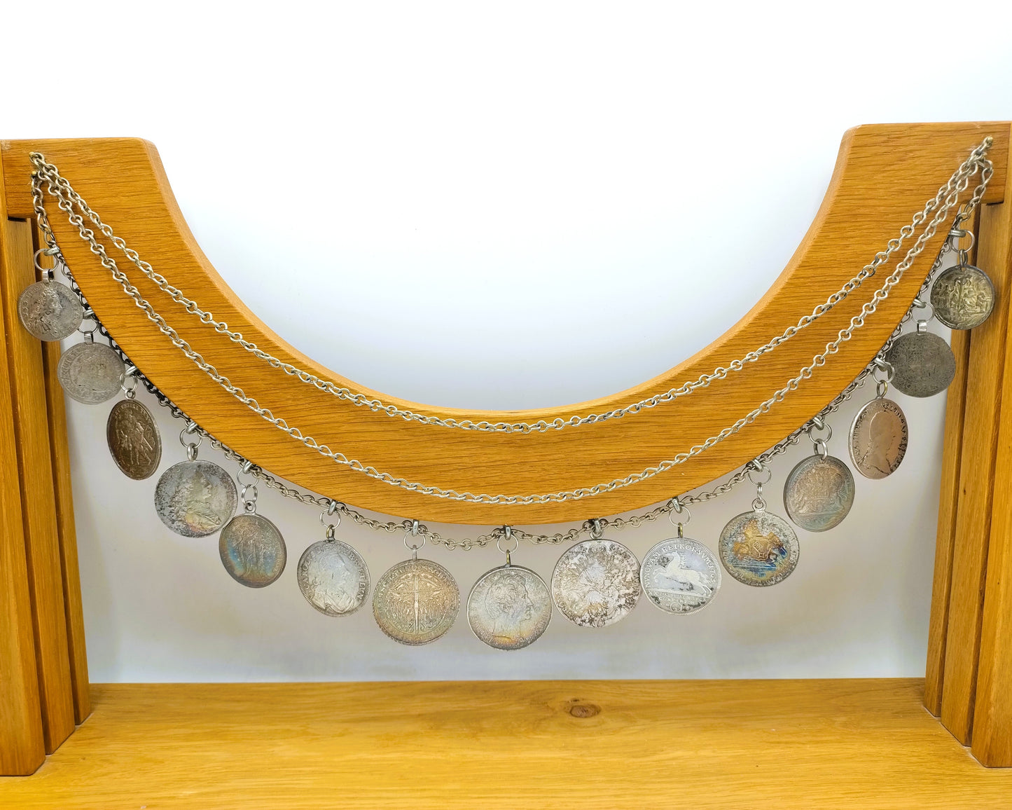 Display cabinet with 15 antique German coins, 16th to 19th century