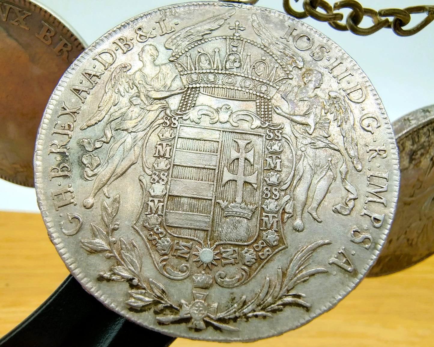 Display cabinet with 15 antique German coins, 16th to 19th century