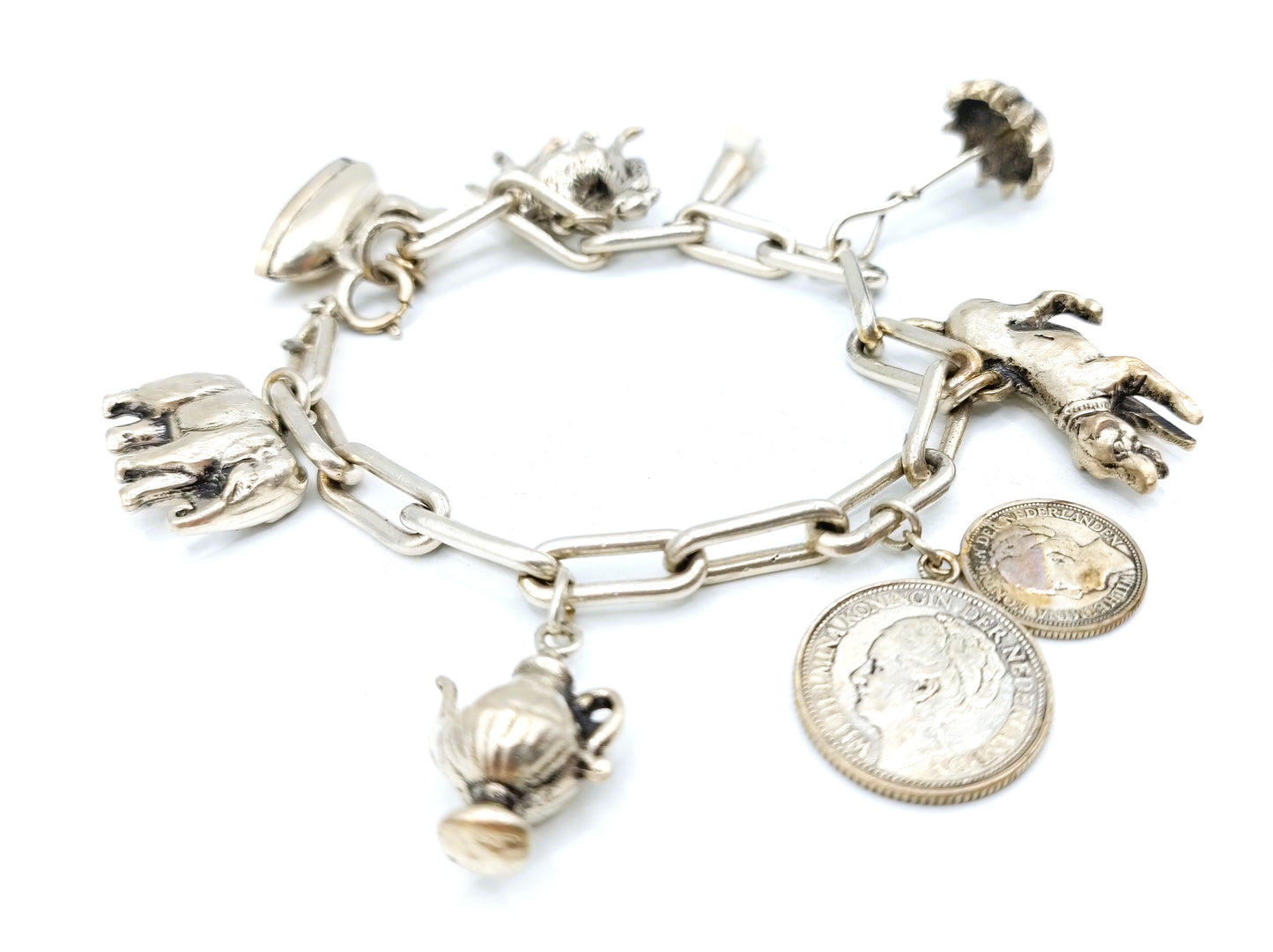 Heavy silver charm bracelet with 9 charms.