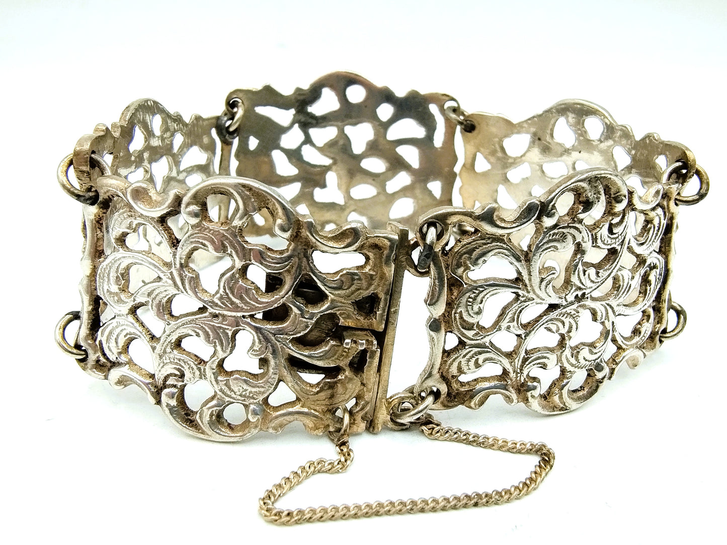 Zilveren schakelarmband met krulmotieven, 835