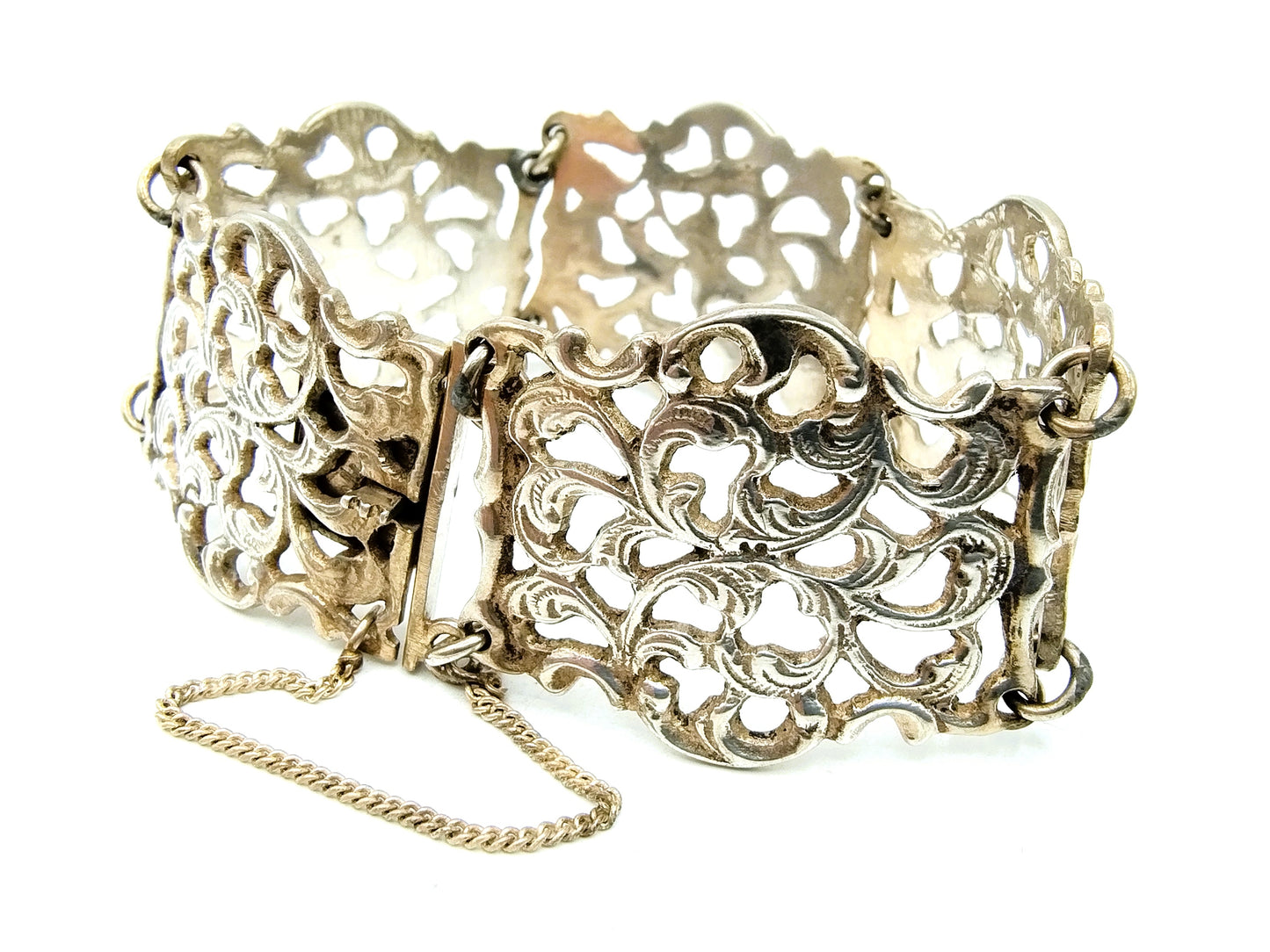 Zilveren schakelarmband met krulmotieven, 835