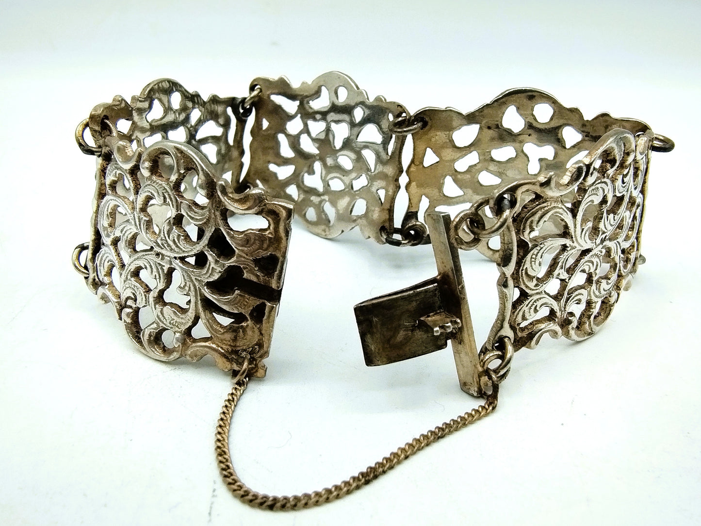 Zilveren schakelarmband met krulmotieven, 835