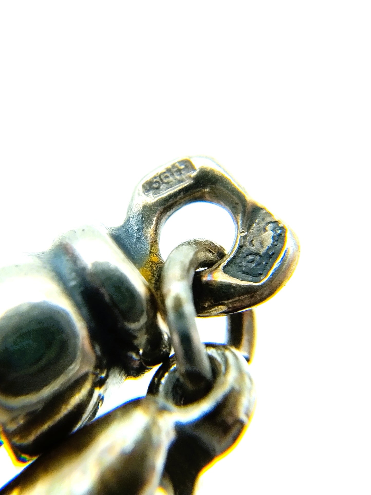Silver chain + bracelet, snake motif.