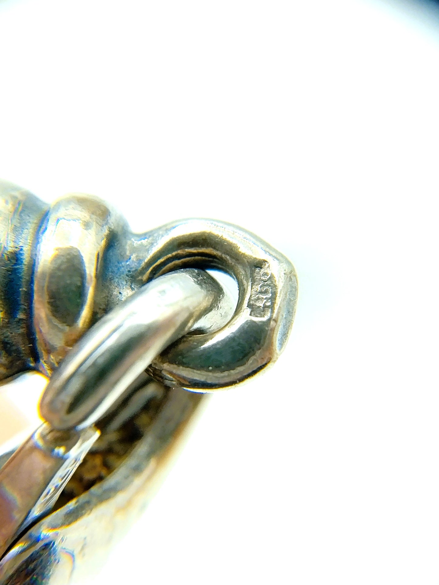 Silver chain + bracelet, snake motif.