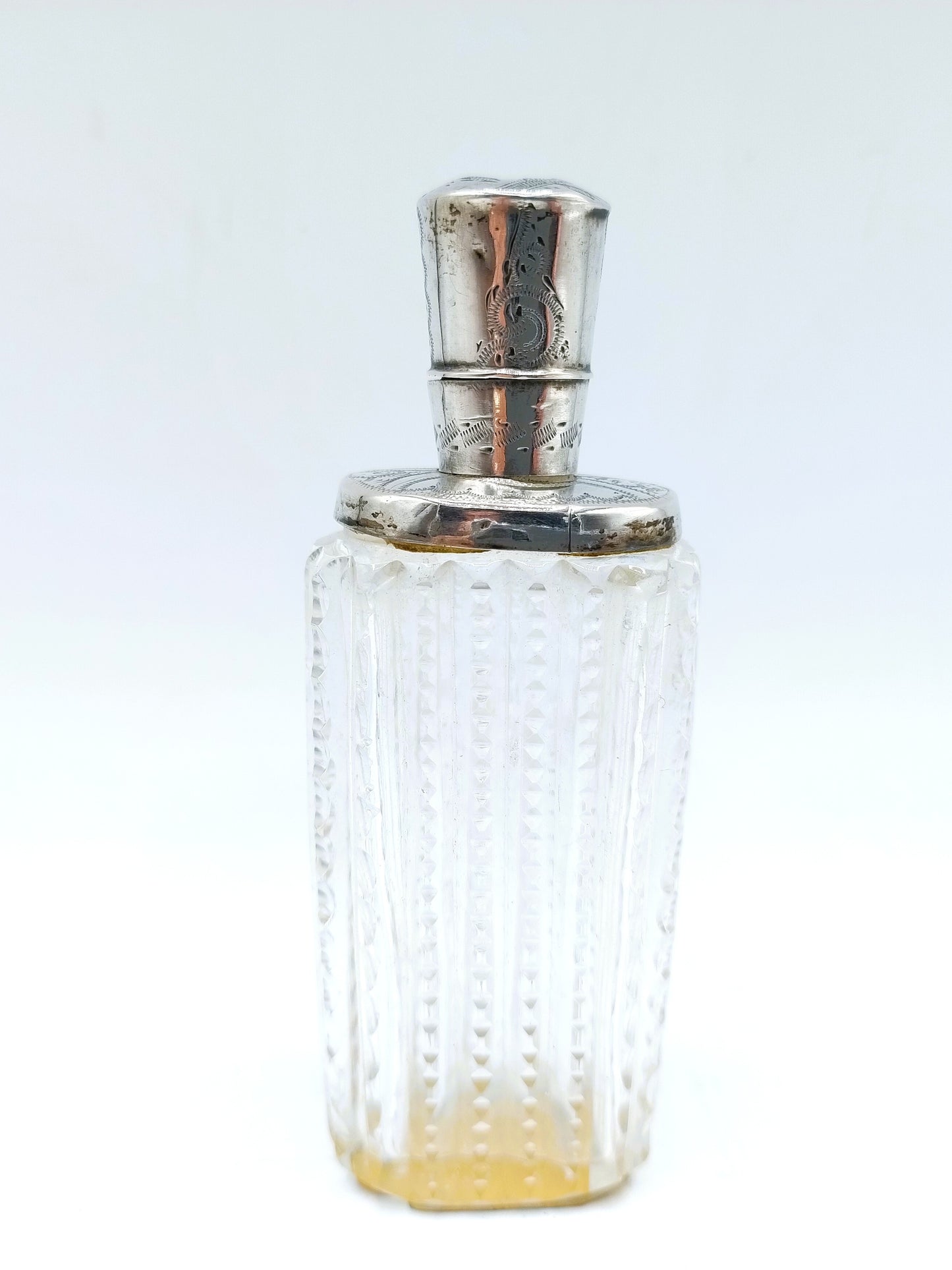 Crystal perfume bottle with silver cap. 19th century.