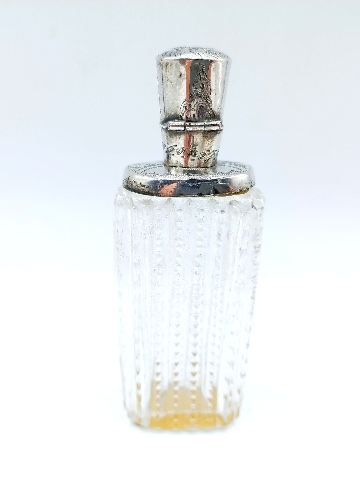 Crystal perfume bottle with silver cap. 19th century.