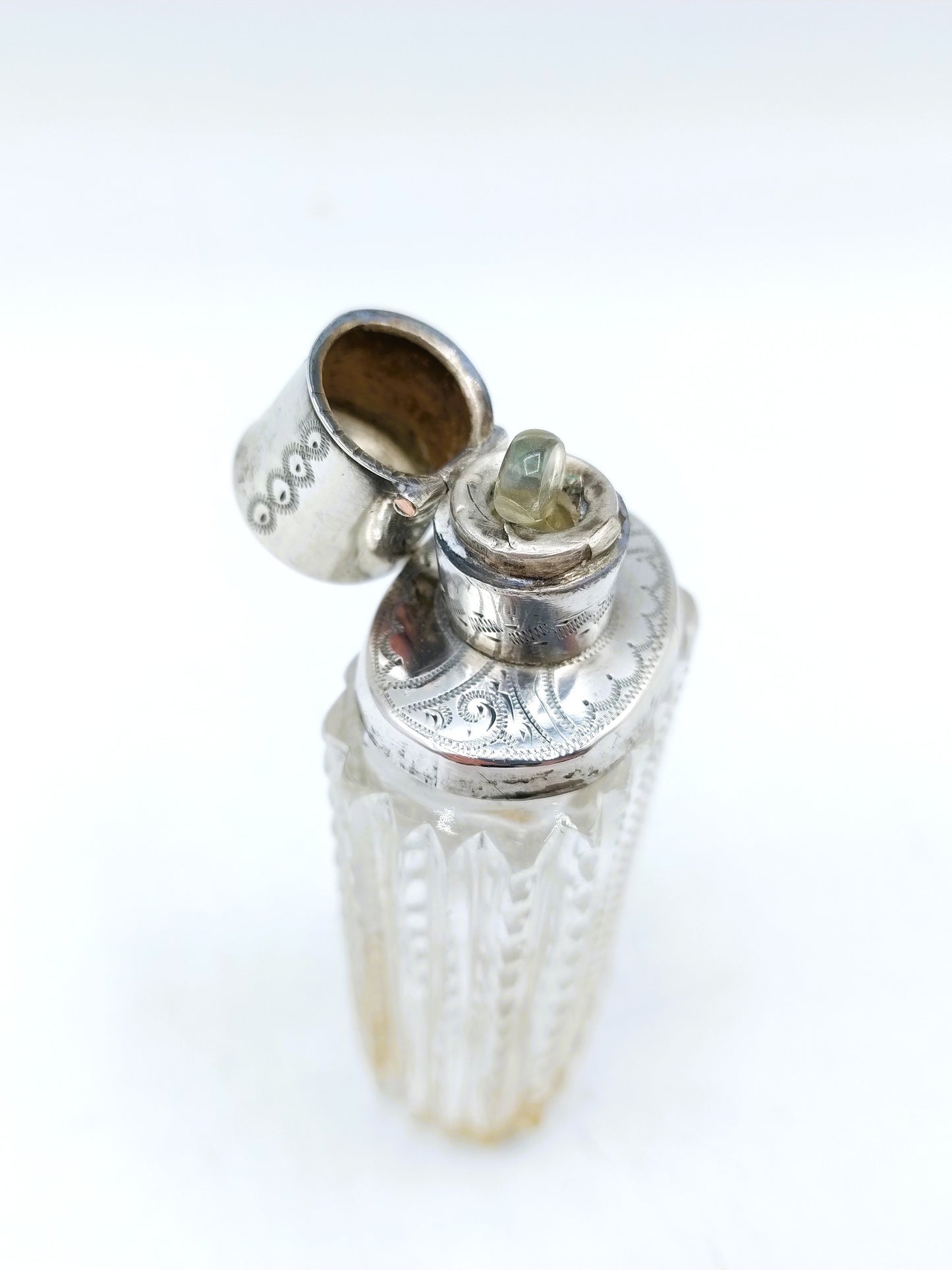 Crystal perfume bottle with silver cap. 19th century.