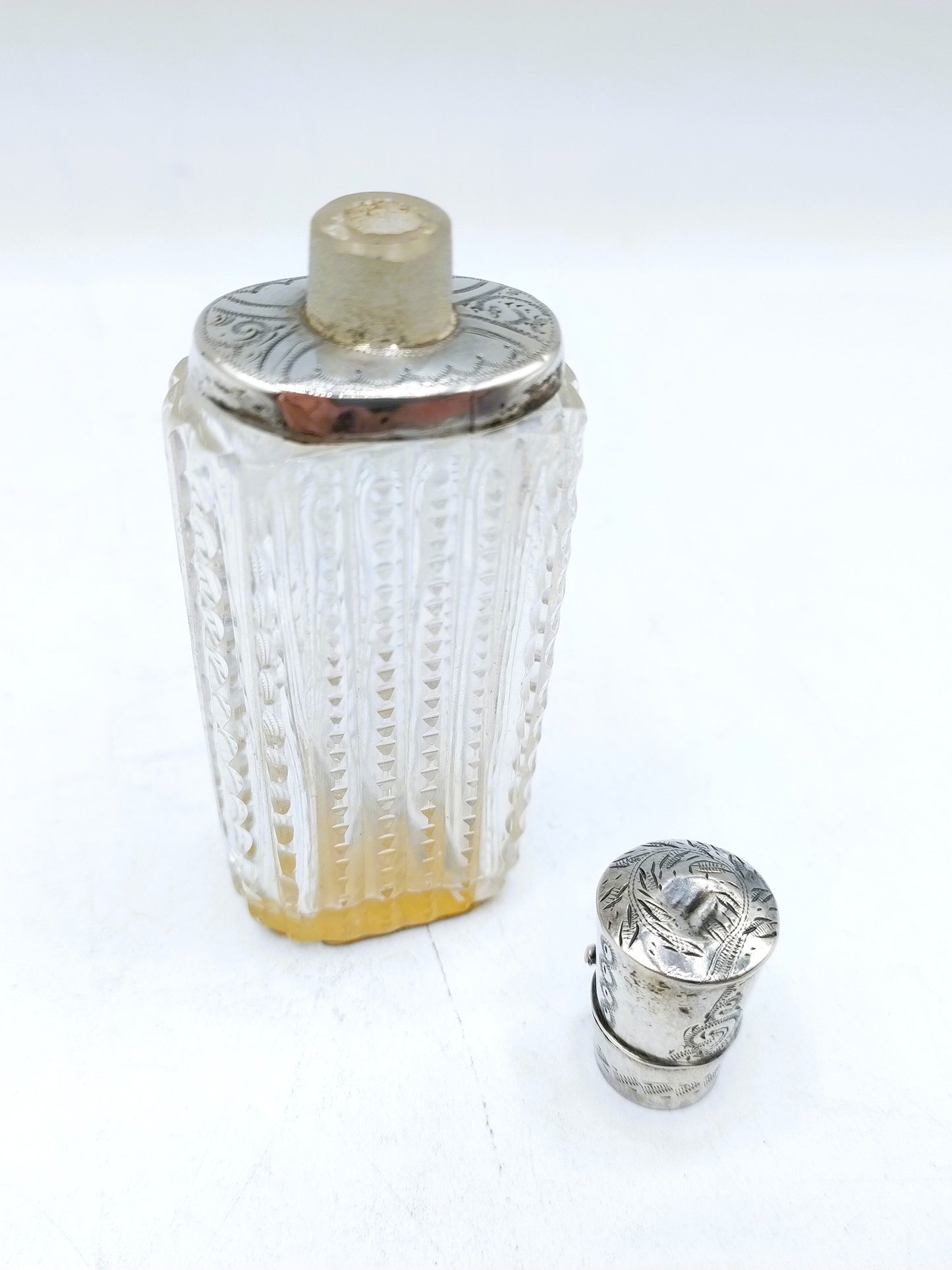 Crystal perfume bottle with silver cap. 19th century.