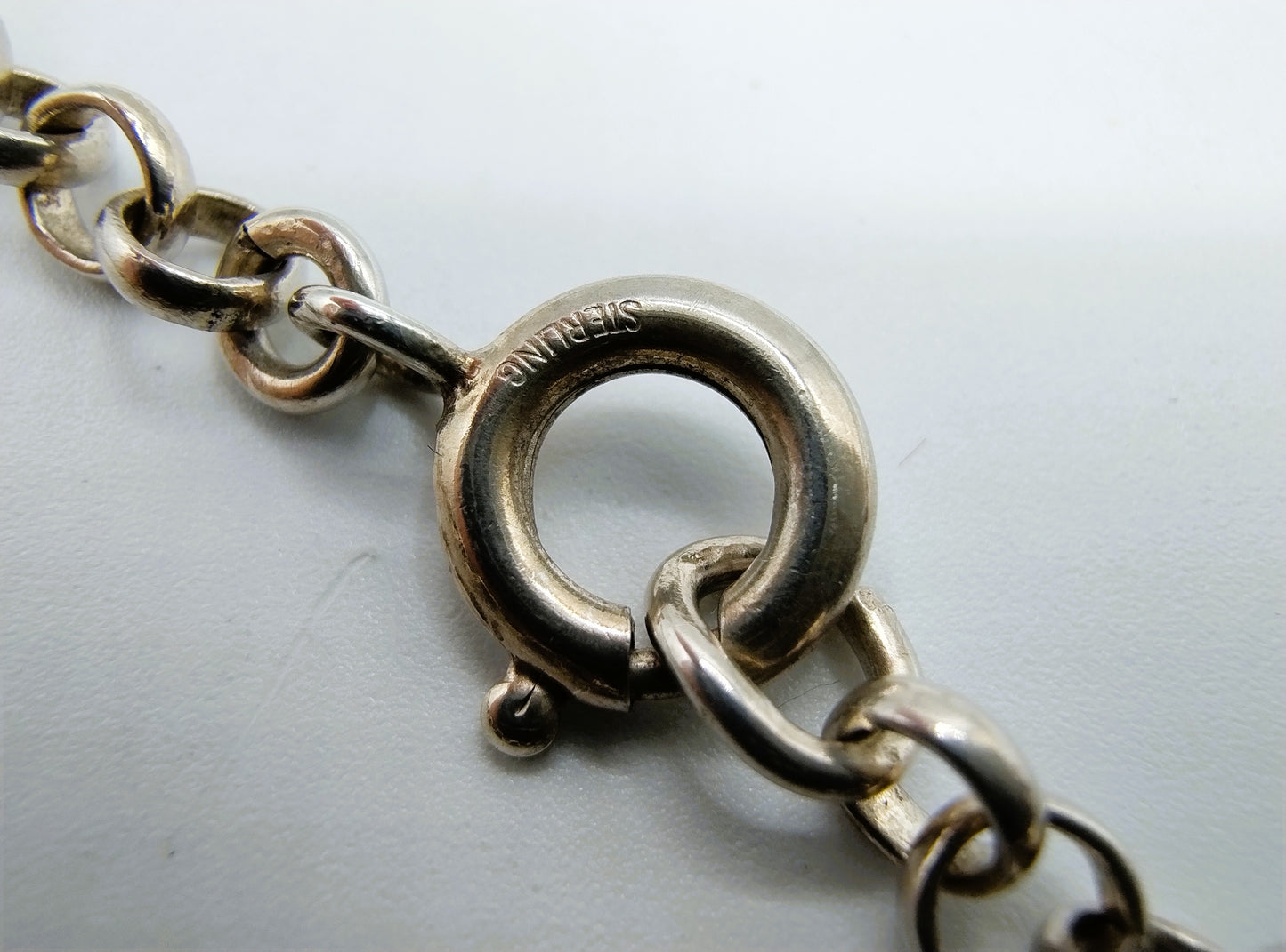 Silver jasseron necklace with silver 10 guilder pendant.