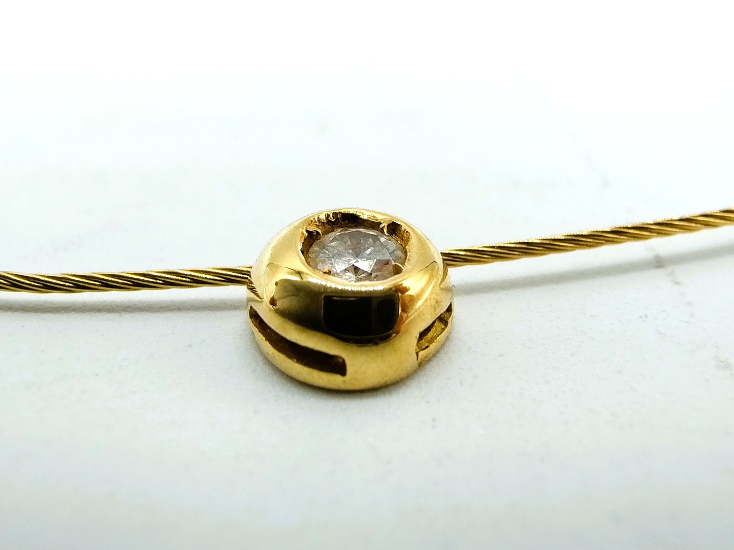 18 carat gold ladies choker with a 0.10 ct diamond.