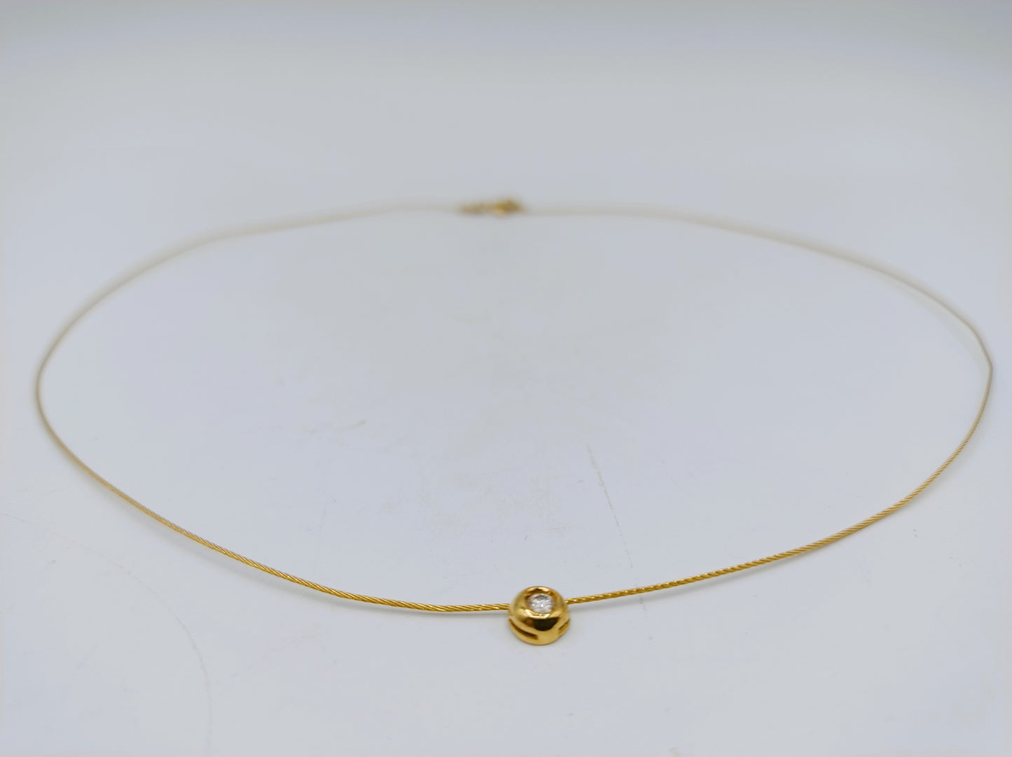 18 carat gold ladies choker with a 0.10 ct diamond.