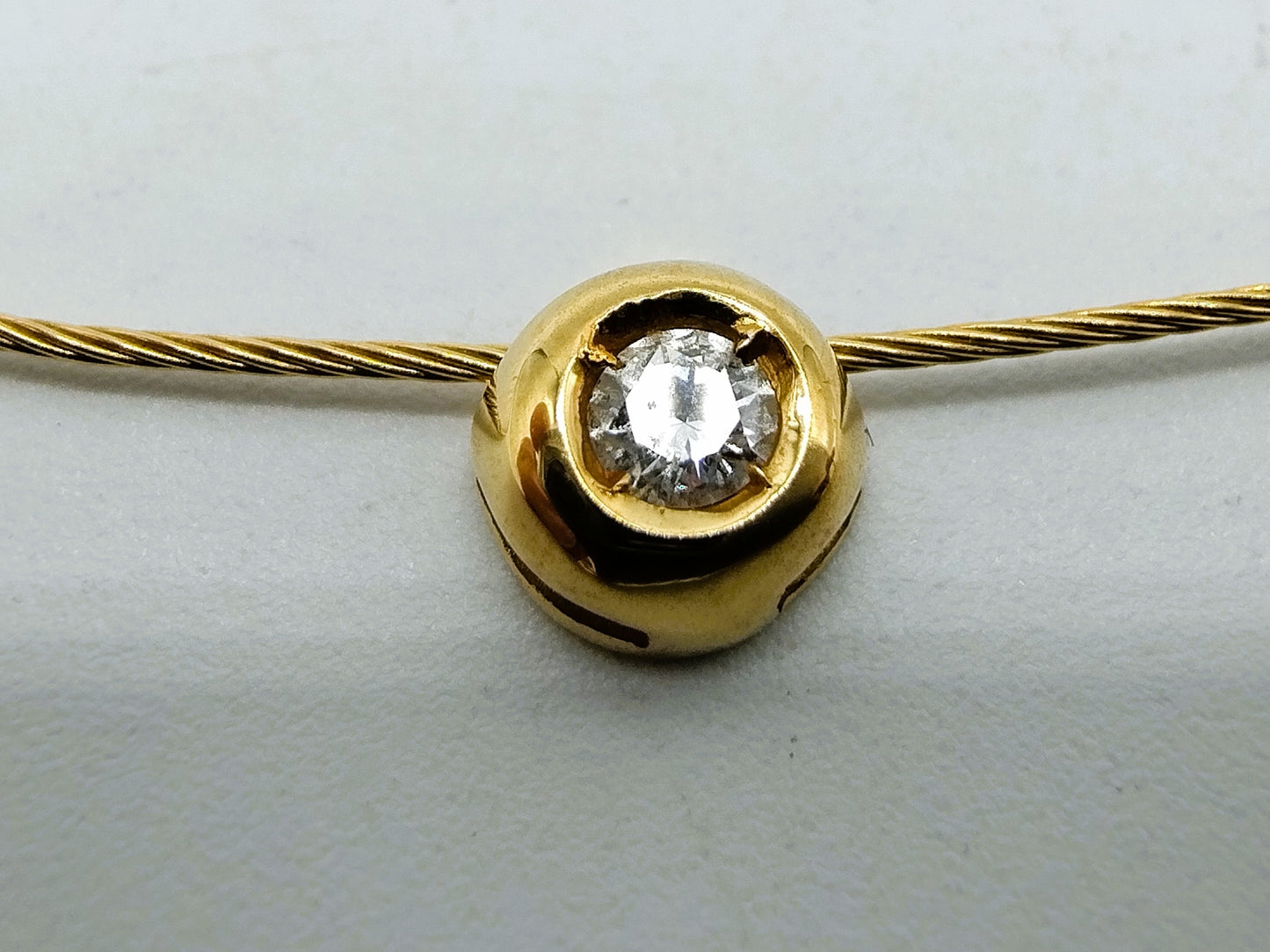 18 carat gold ladies choker with a 0.10 ct diamond.