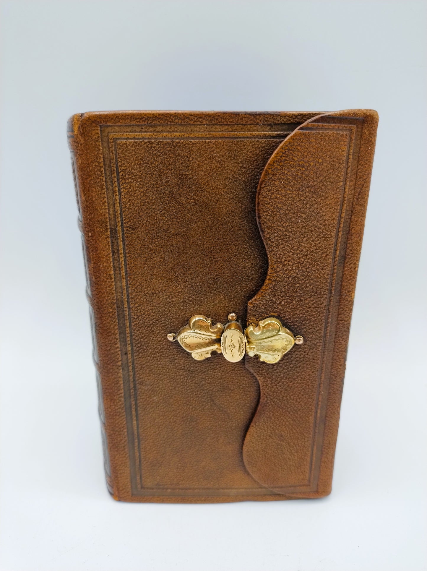 Bible with gold clip lock, 1884