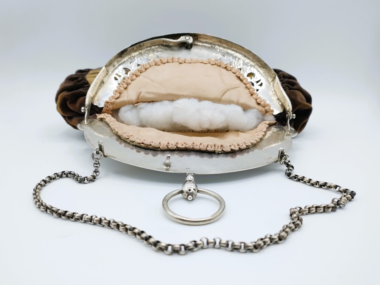 Petit Point bag with silver handle.