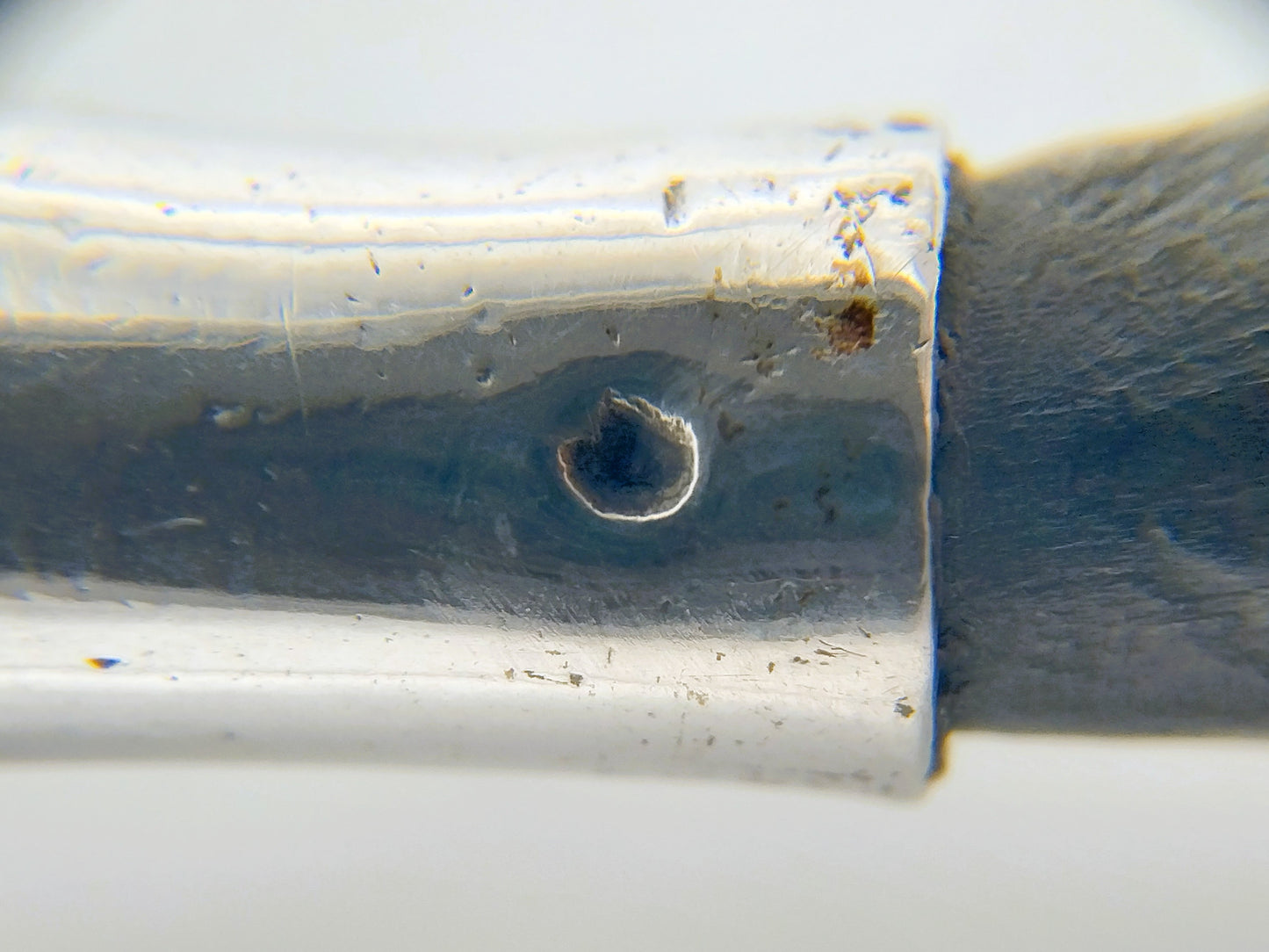 Zilveren strooilepel met ebbenhouten steel
