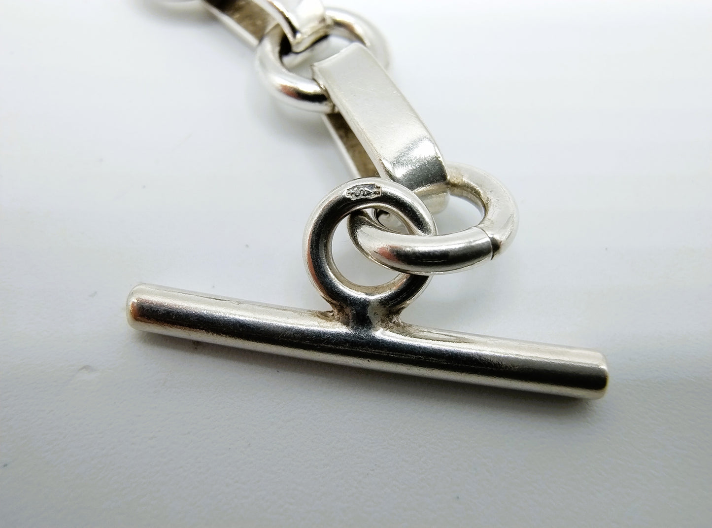 Zilveren schakelarmband met kapittelsluiting, 19 cm.