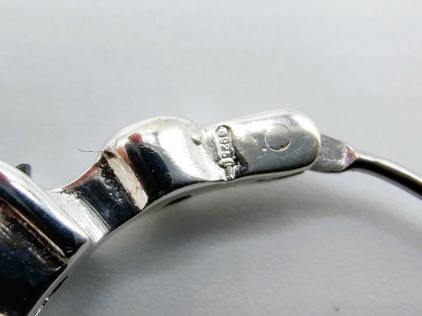 Silver hoop earrings with black stones
