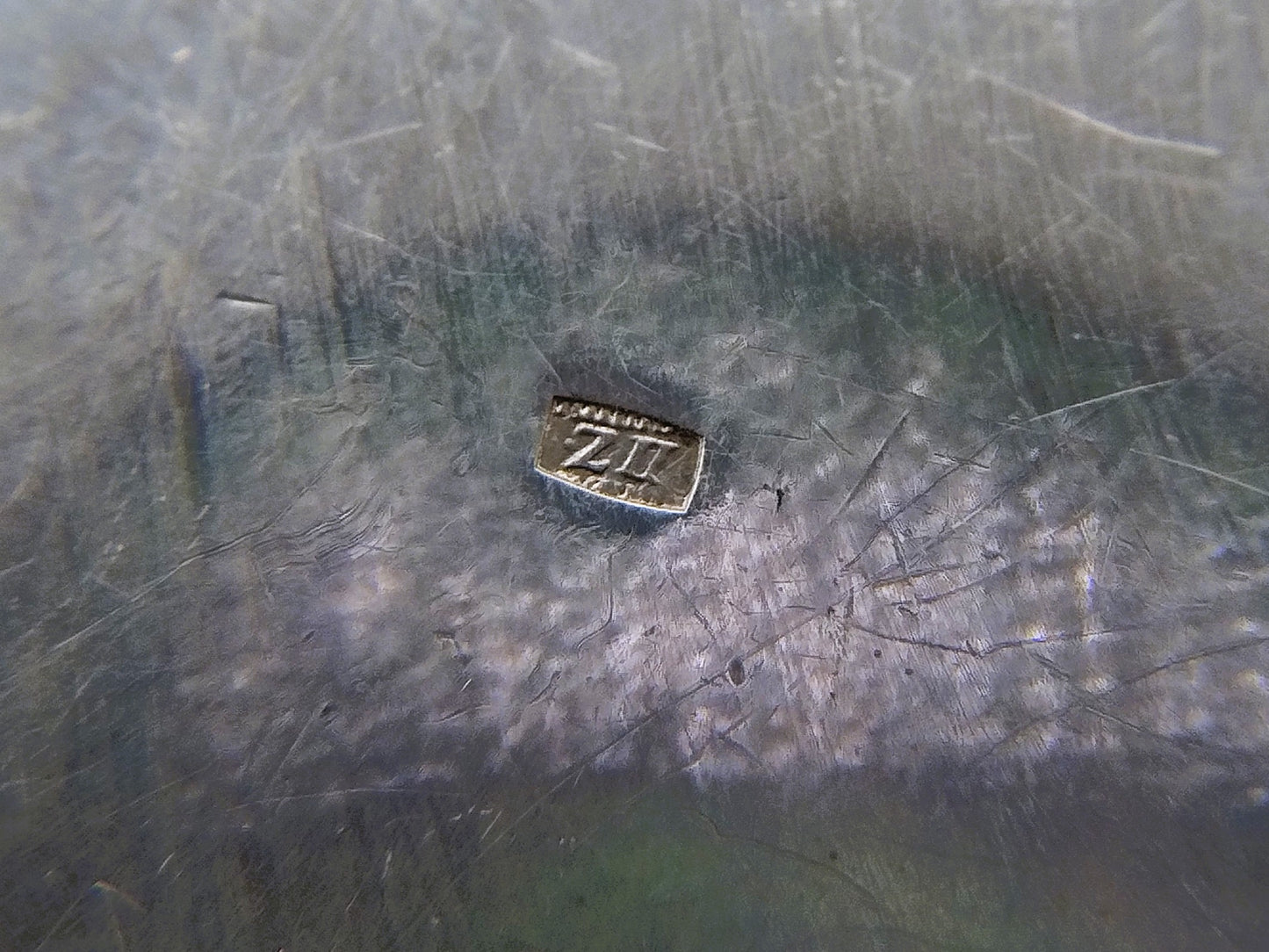 Silver pill box with a floral decoration