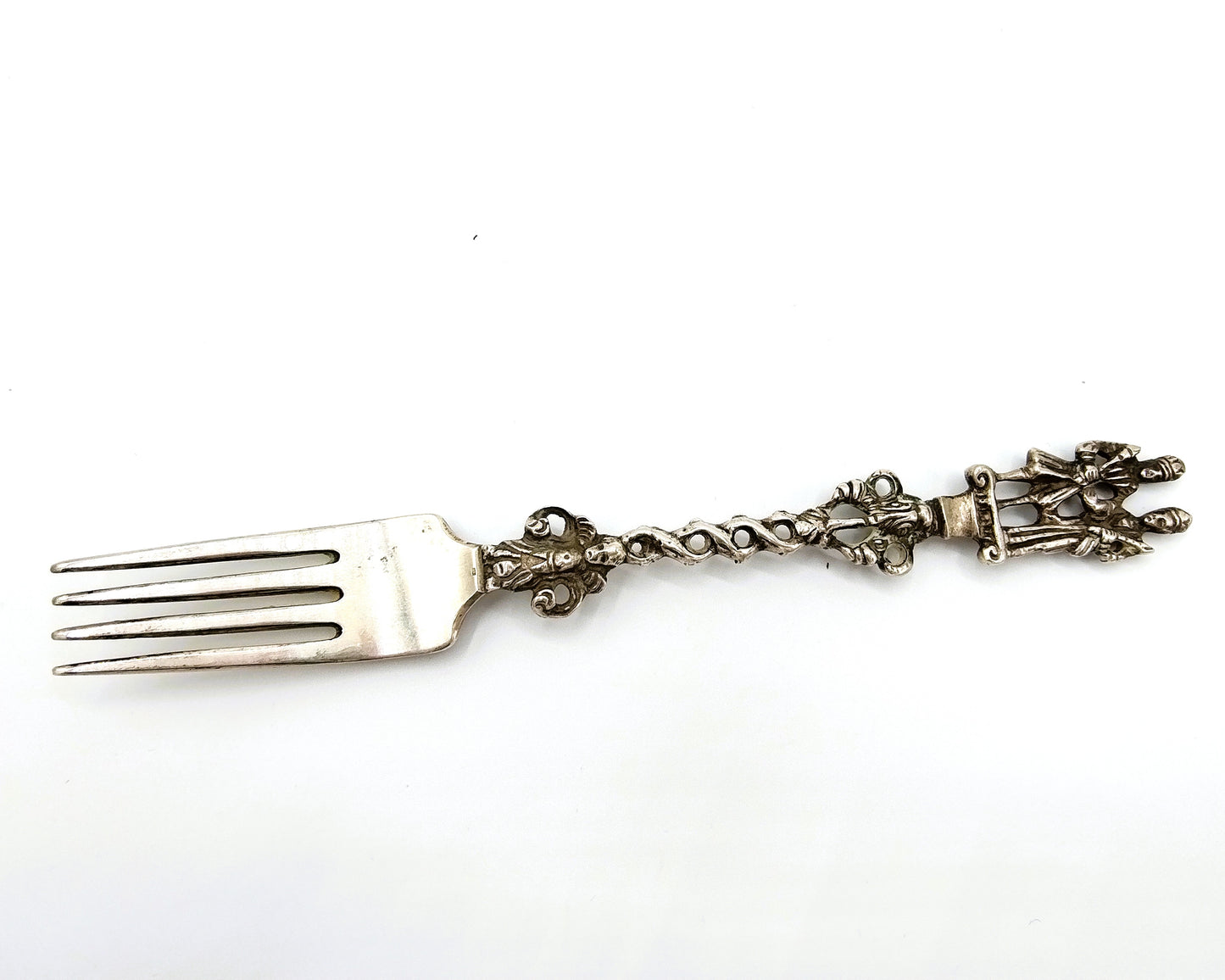 Silver ornamental fork, pseudomarks, 19th century.