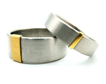 2 Steel rings with gold application, 585