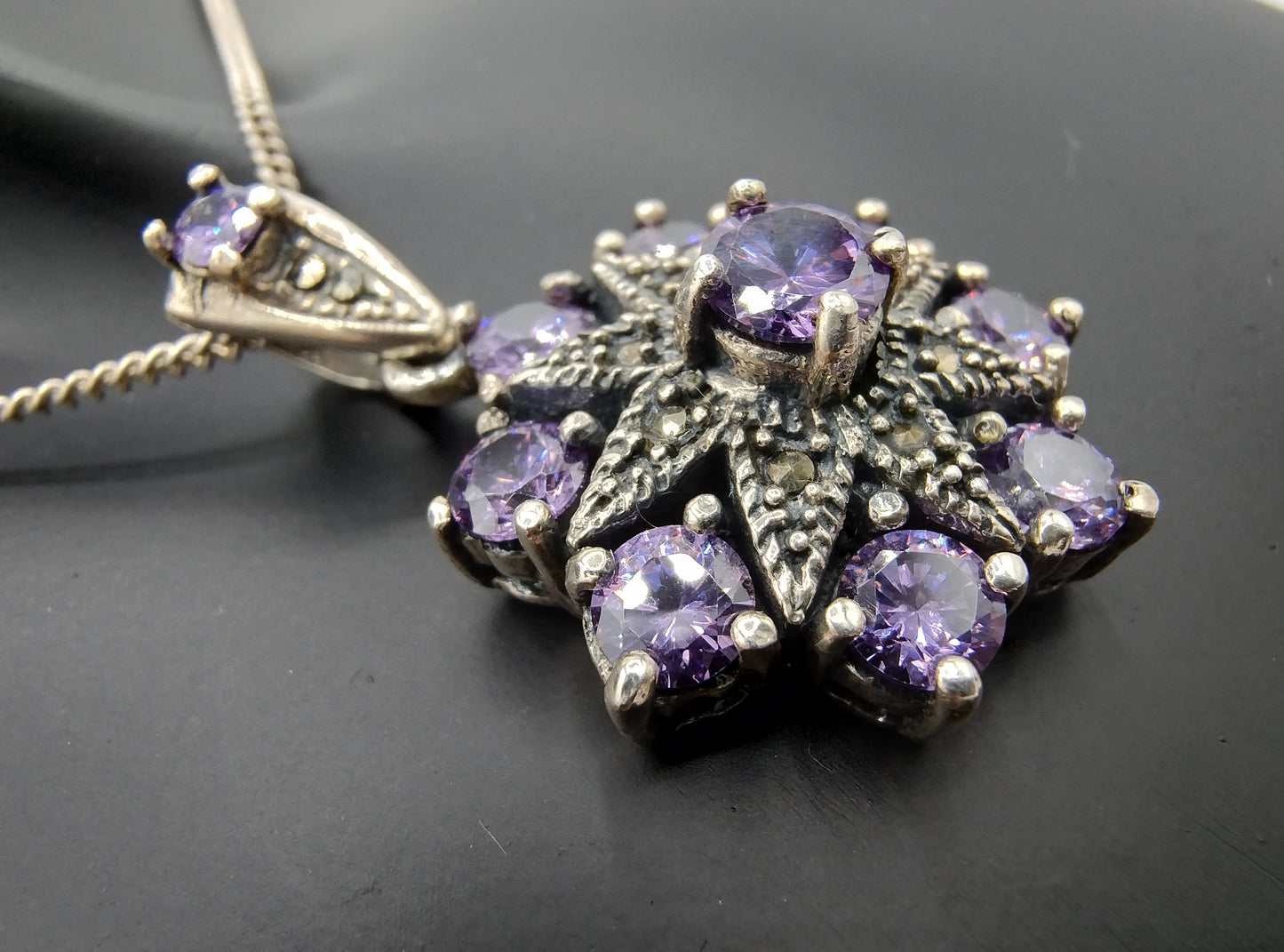 Silver pendant set with Amethyst (?)