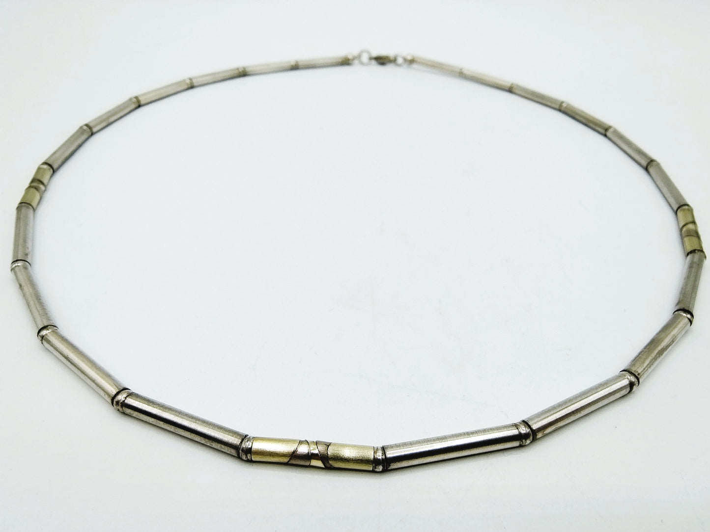 Silver chain with gold links on metal, 925/585