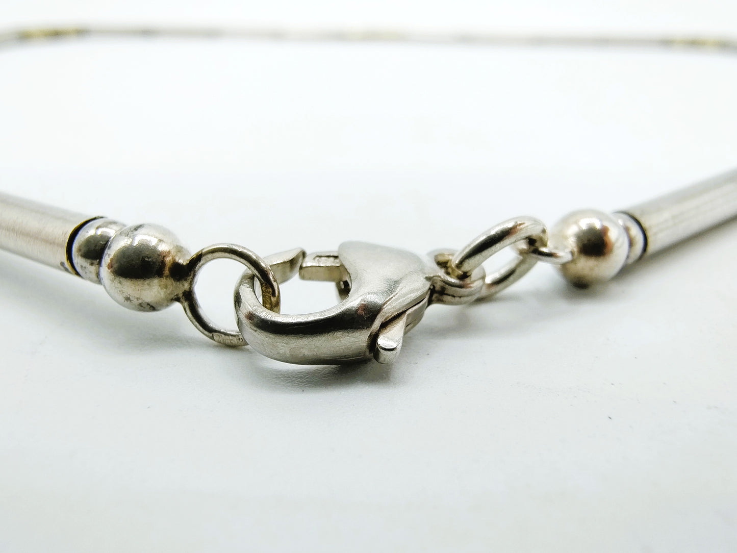 Silver chain with gold links on metal, 925/585