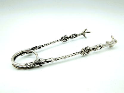 Silver clot tongs with apostles, Schoonhoven, 19th century