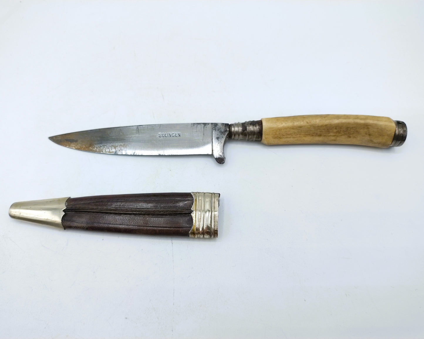 Hunting knife in leather sheath with silver fittings, 19th century