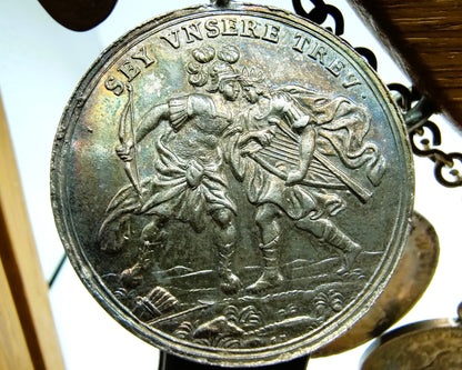 Display cabinet with 15 antique German coins, 16th to 19th century