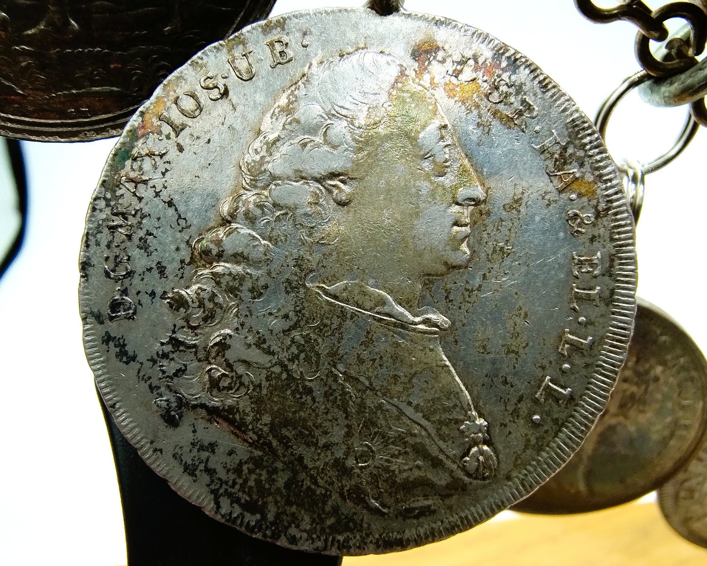 Display cabinet with 15 antique German coins, 16th to 19th century