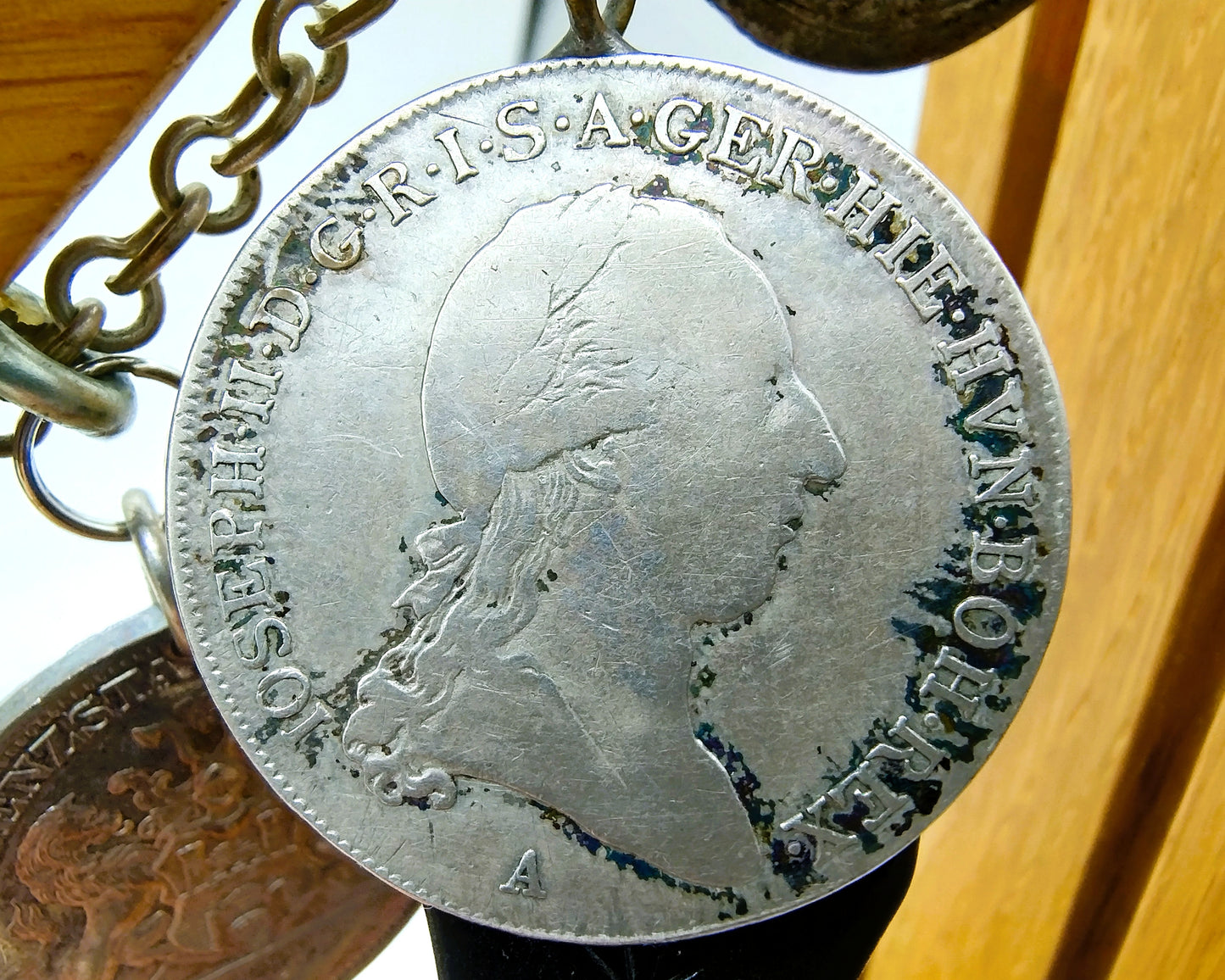 Display cabinet with 15 antique German coins, 16th to 19th century