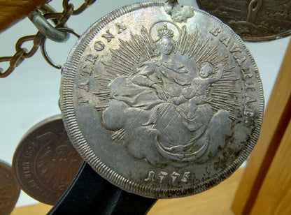 Display cabinet with 15 antique German coins, 16th to 19th century