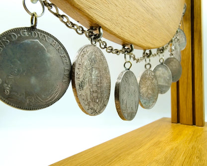 Display cabinet with 15 antique German coins, 16th to 19th century