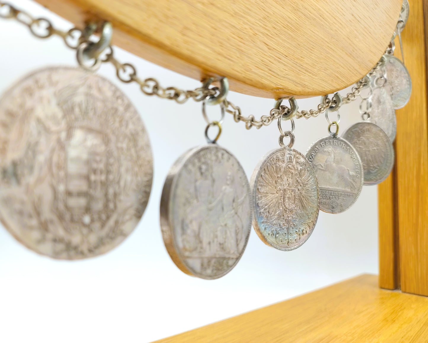 Display cabinet with 15 antique German coins, 16th to 19th century