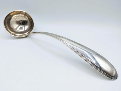 Silver soup spoon with pearl rim, Amsterdam, 19th century.