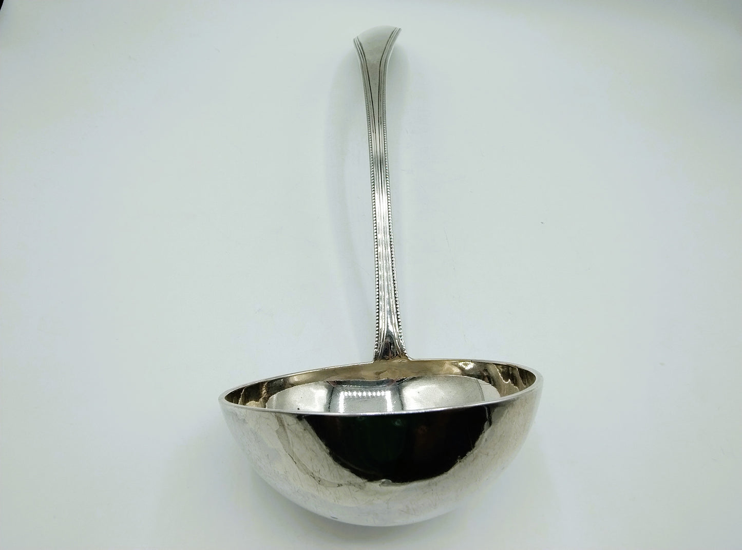 Silver soup spoon with pearl rim, Amsterdam, 19th century.