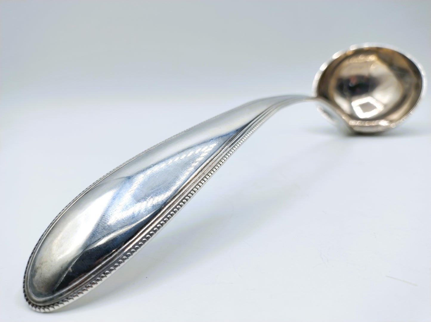 Silver soup spoon with pearl rim, Amsterdam, 19th century.