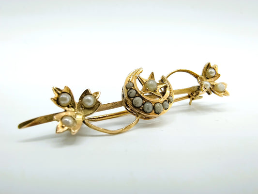 Golden brooch with natural saltwater pearls