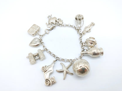 Silver charm bracelet with 11 charms, 18 cm