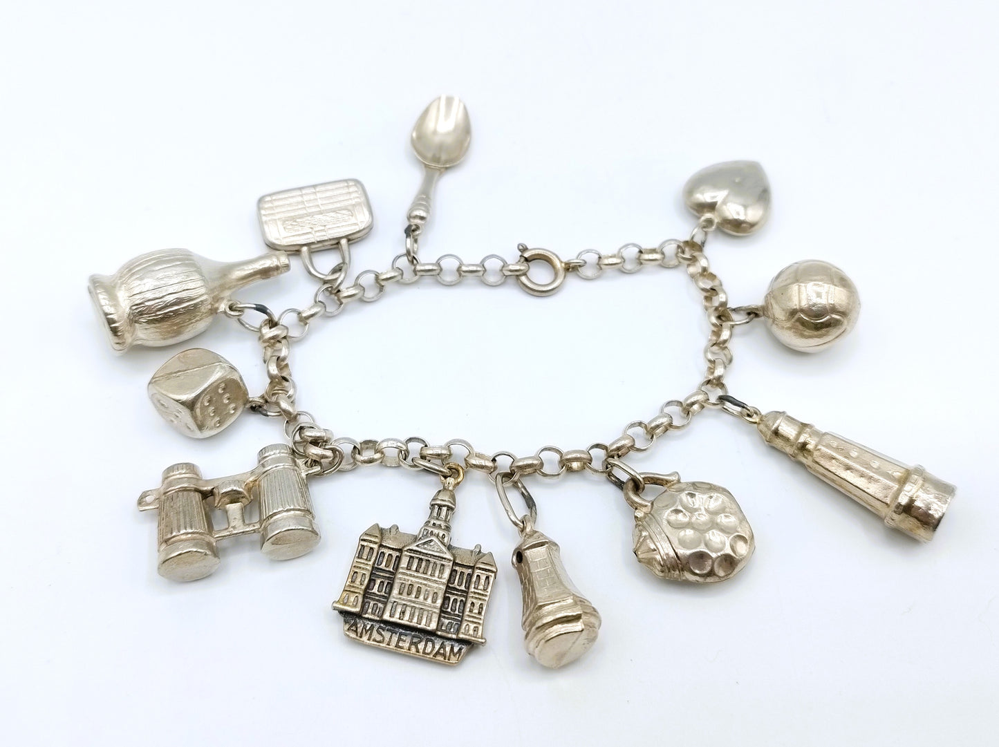 Silver charm bracelet with 11 charms, 18 cm