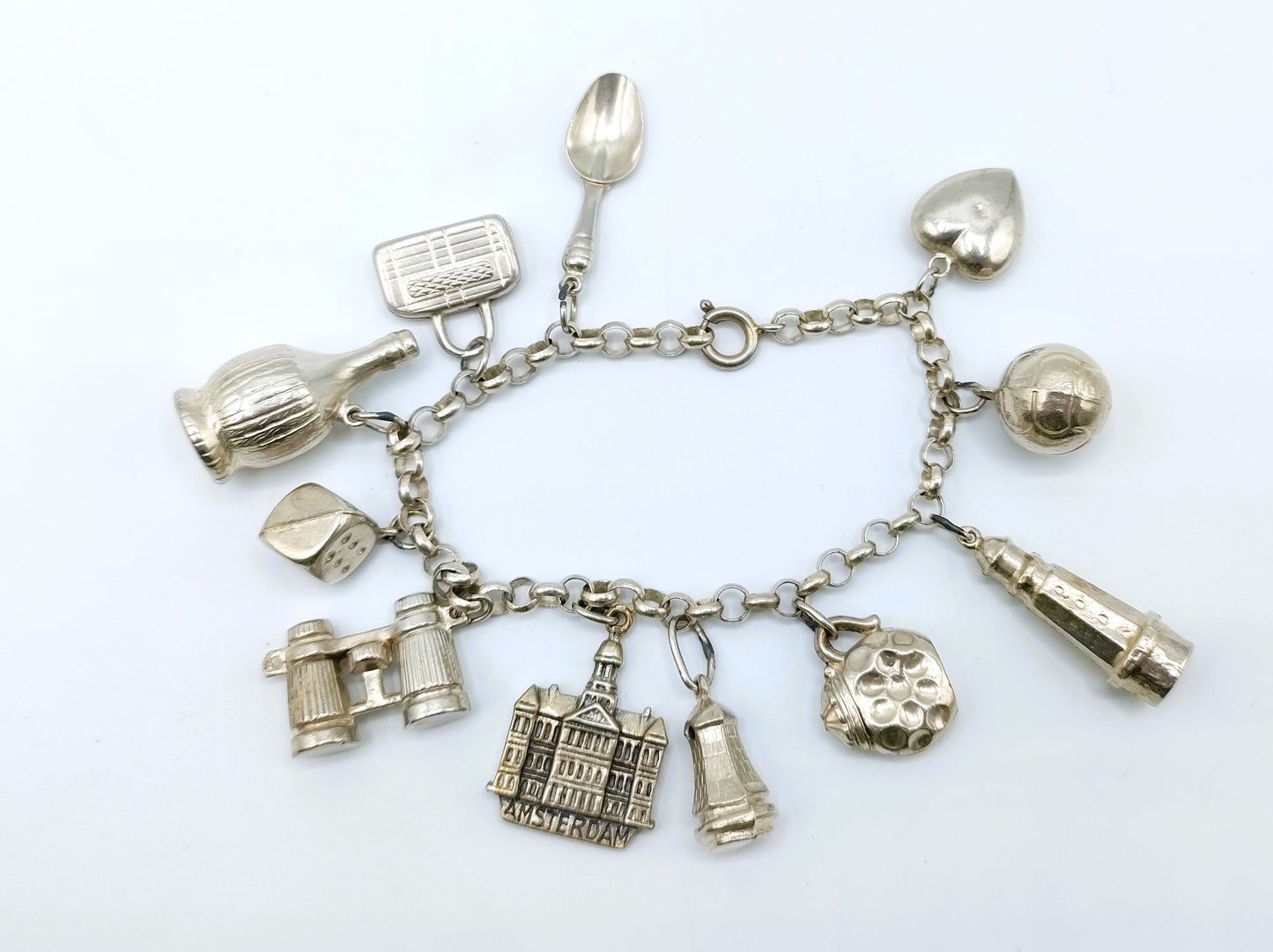 Silver charm bracelet with 11 charms, 18 cm