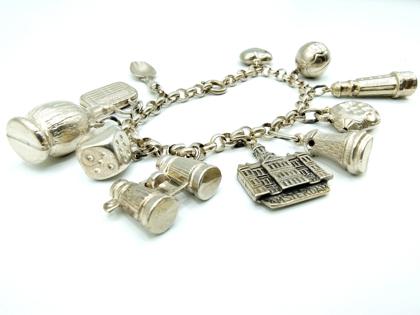 Silver charm bracelet with 11 charms, 18 cm