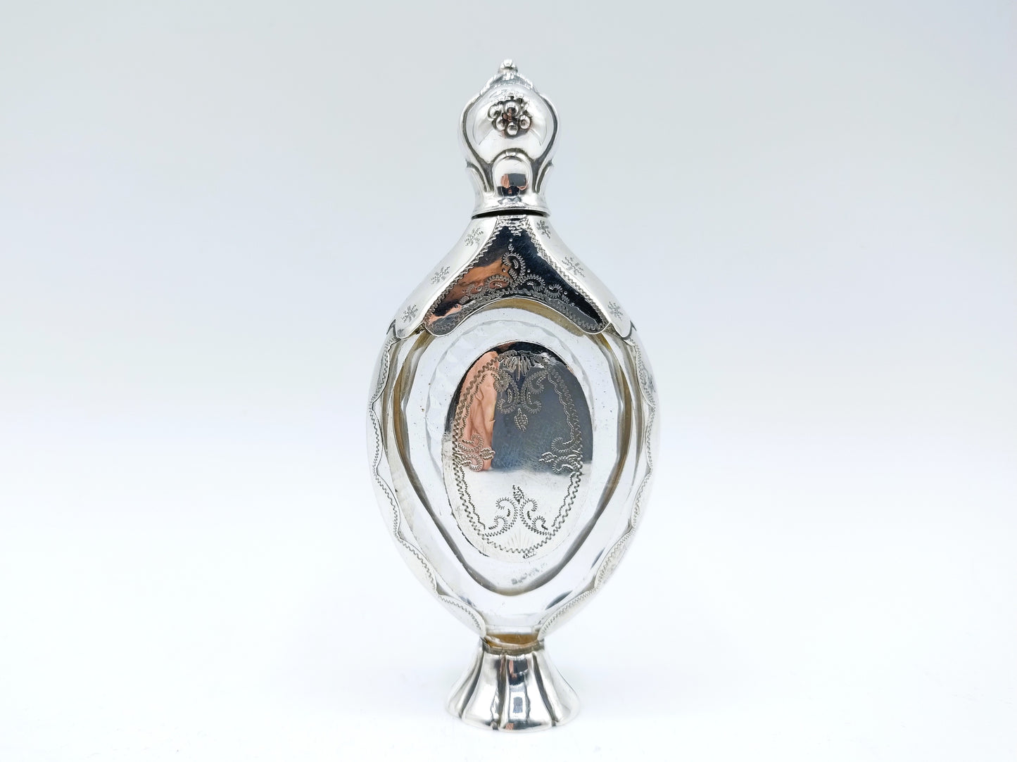 Crystal perfume bottle with silver fittings. 19th century.