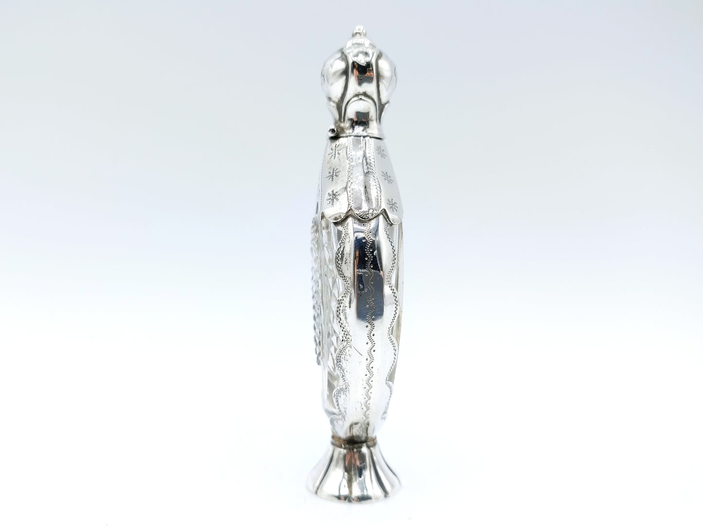 Crystal perfume bottle with silver fittings. 19th century.