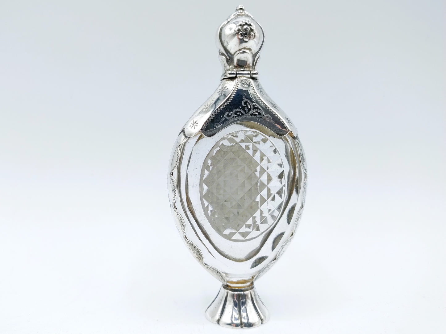 Crystal perfume bottle with silver fittings. 19th century.