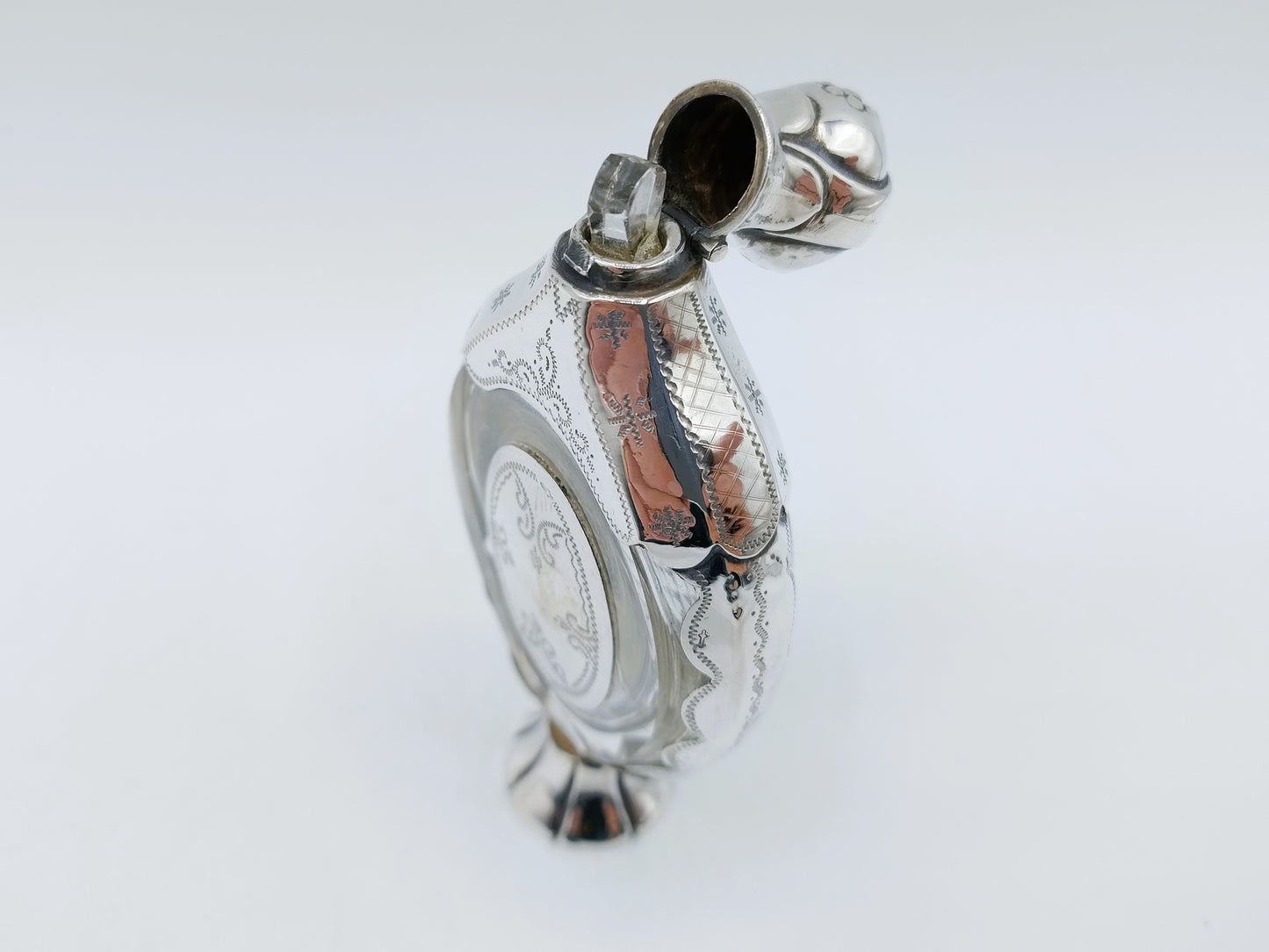 Crystal perfume bottle with silver fittings. 19th century.